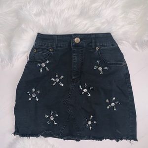 Black jeweled mini skirt